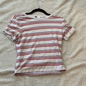 Red, white, and blue striped shirt.